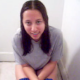A brunette girl cuts some great, wet-sounding farts as she sits on a toilet. Her friend faithfully records the event on video while laughing in the background.